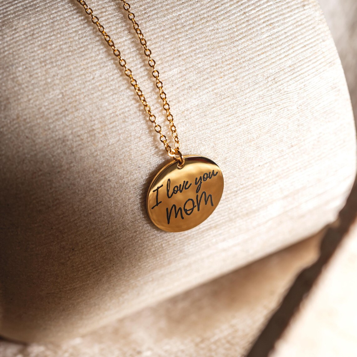 Personalized handwriting disc necklace in gold, featuring custom engraving on a round pendant